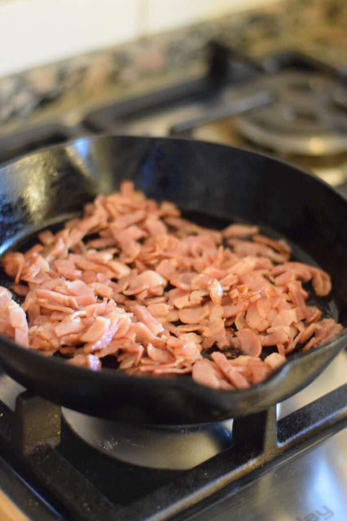 Cooking bacon in a skillet.