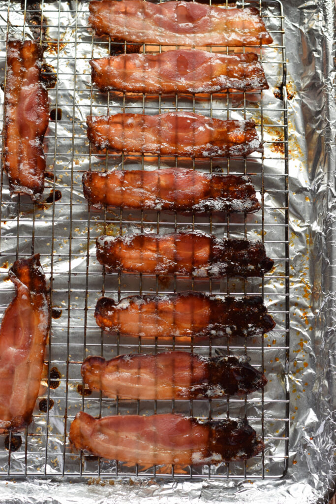 Candied bacon on a baking tray.