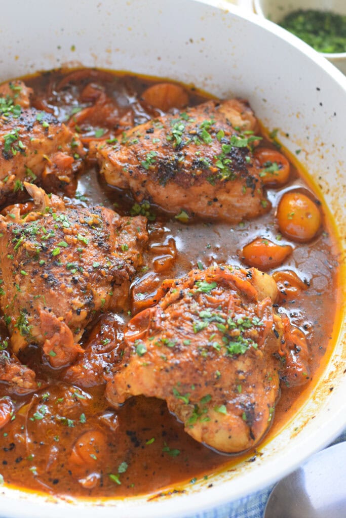 close up of skillet tomato chicken.