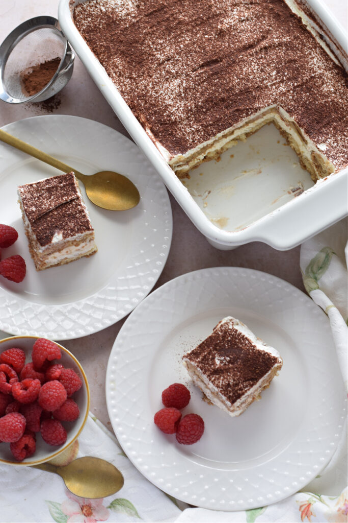 Tiramisu on white serving plates.