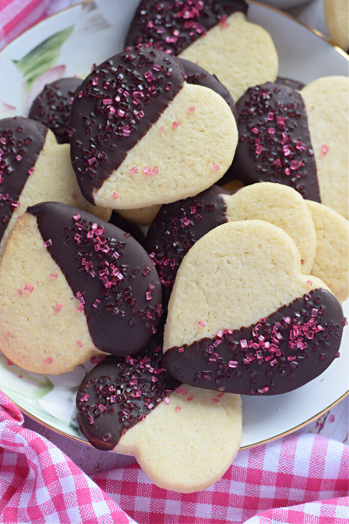 Chocolate heart cookies on a plate.