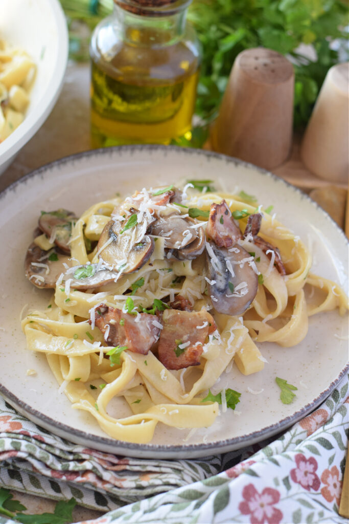 Close up of creamy pasta with mushrooms.