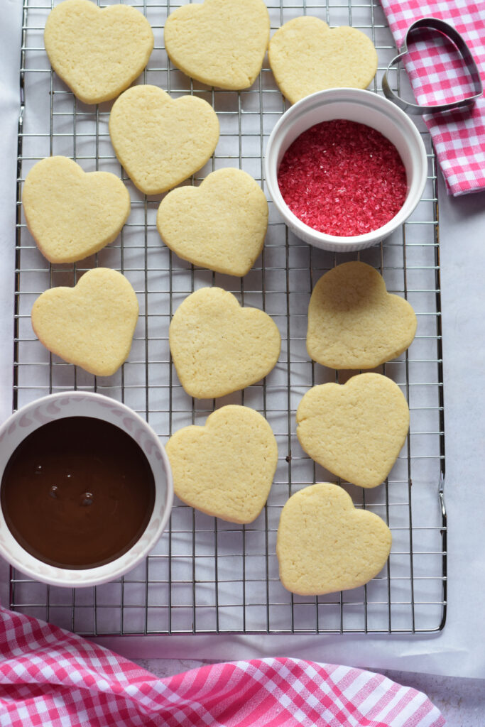 Chocolate heart cookies on a baking tray.