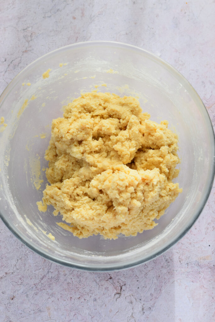 Making cookie dough in a glass bowl.