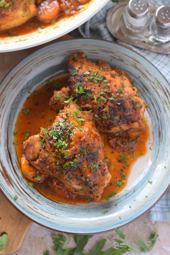 Stovetop chicken thighs in a tomato sauce.