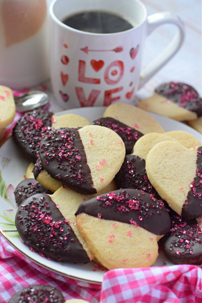 Chocolate dipped sugar cookies on a plate.