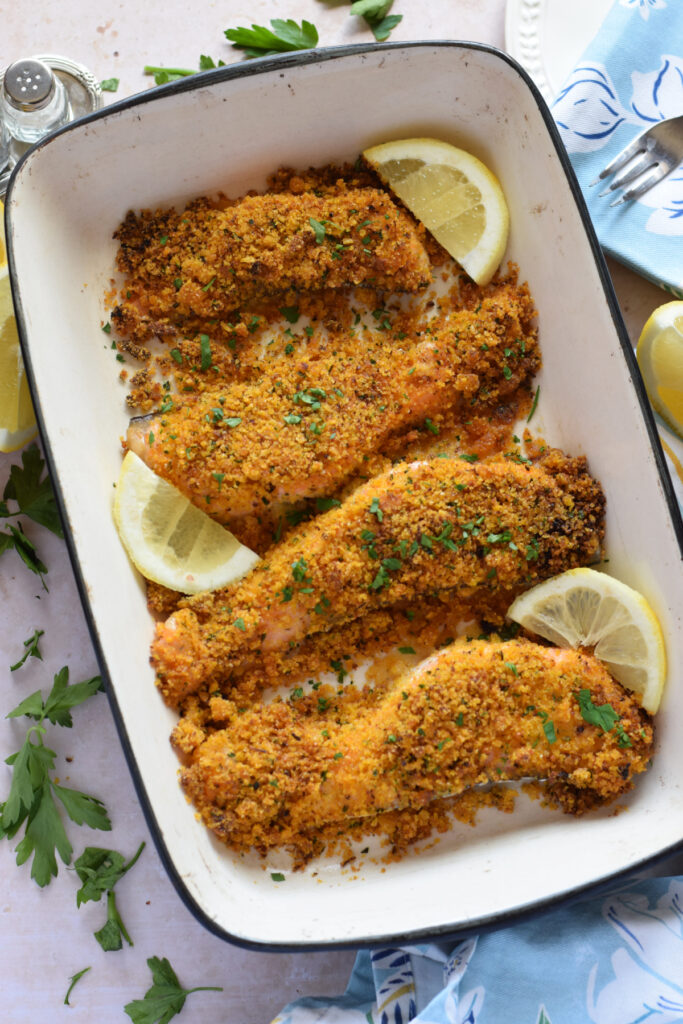 Panko crusted salmon in a baking dish.
