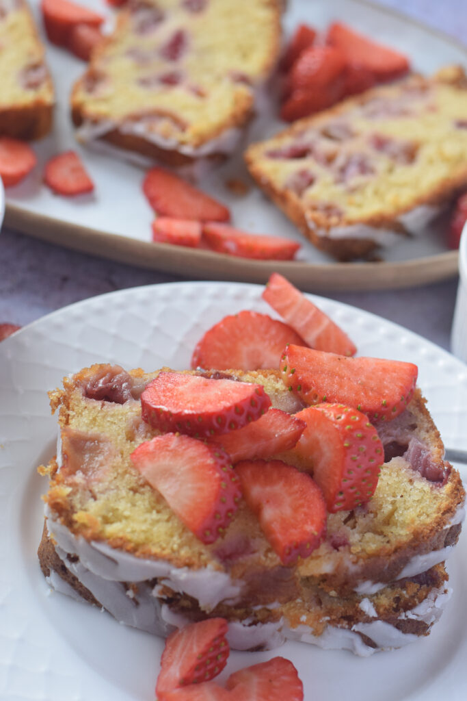 Close up of a slice of strawberry loaf cake.