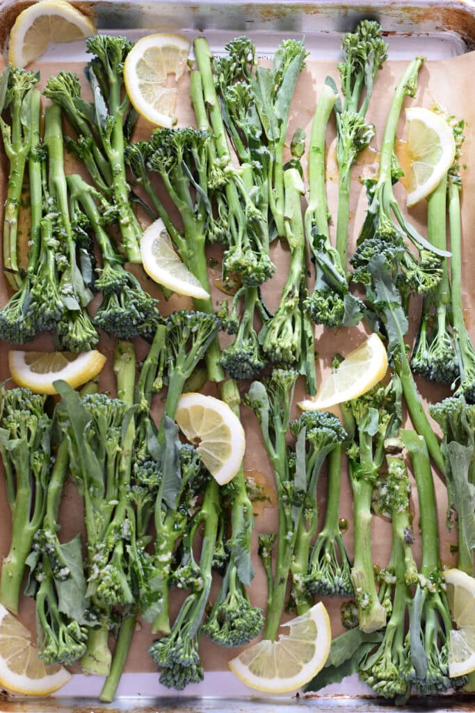 Broccolini on a baking tray.