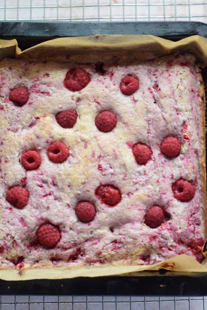 Baked raspberry cake in a baking pan.