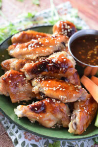 Baked teriyaki chicken wings with sesame seeds.