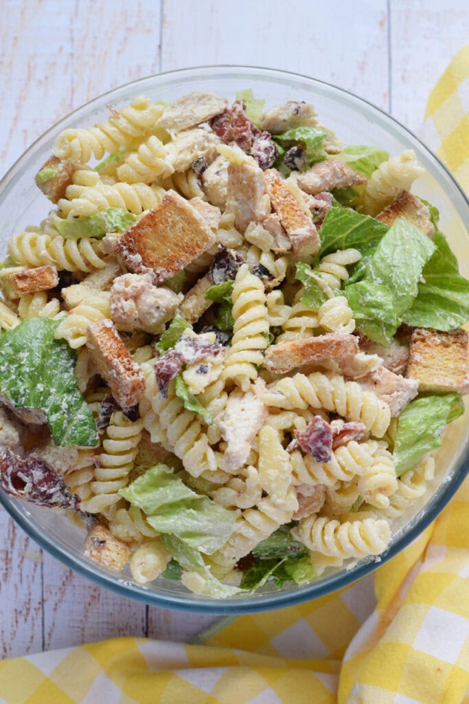 Chicken pasta salad in a glass bowl.