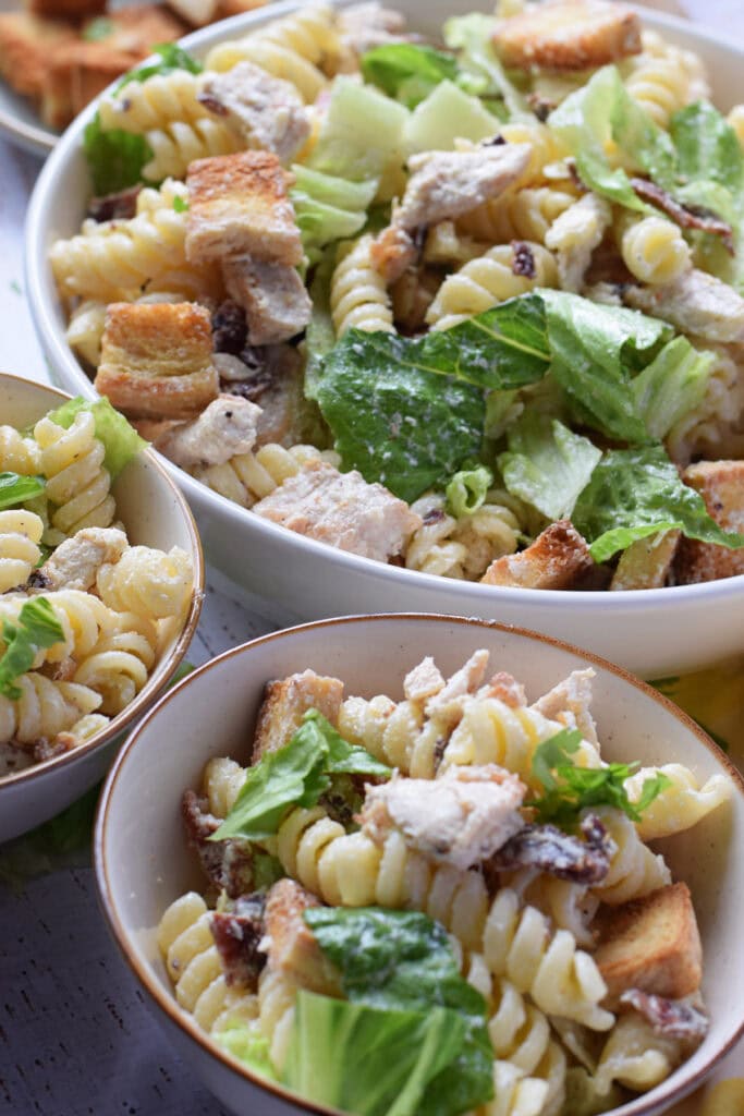 Chicken pasta salad in serving bowls.