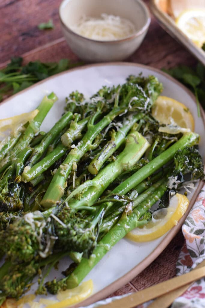 Roasted broccolini on a serving dish.
