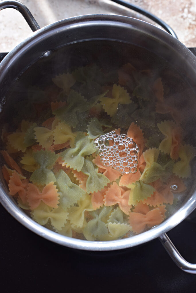 Cooking pasta in simmering water.