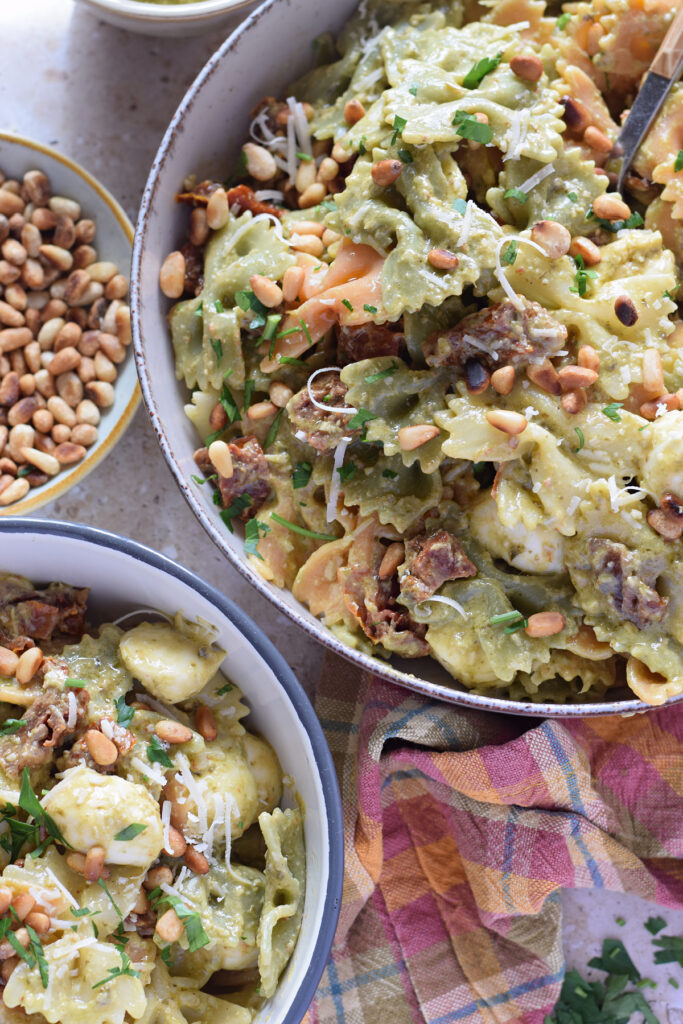 Pasta salad with bowtie pasta and green pesto.
