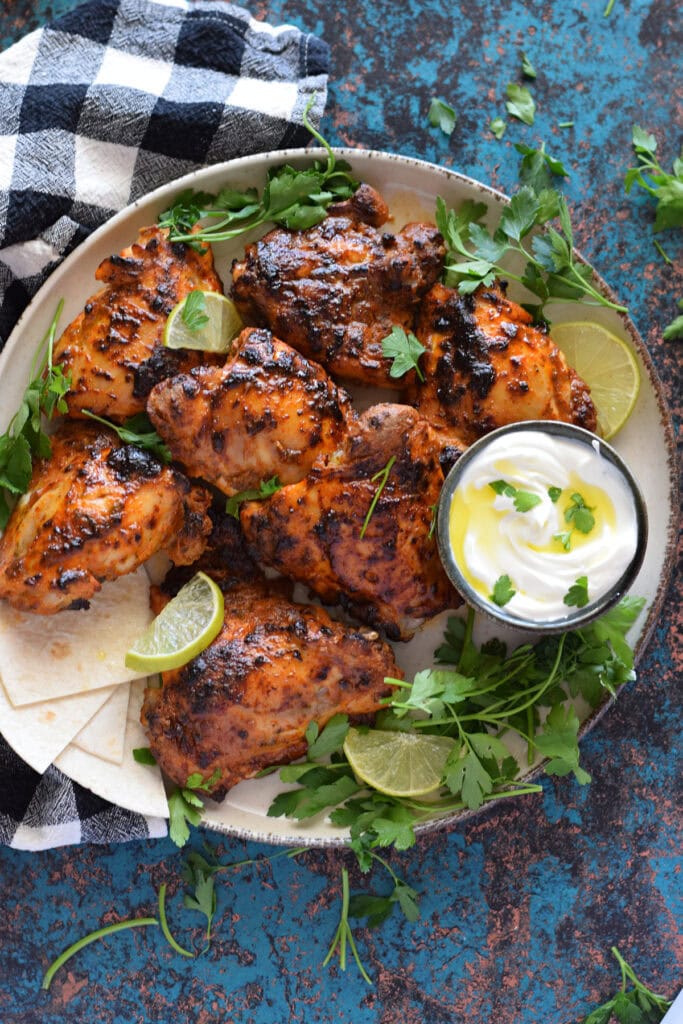 Marinated chicken on a serving platter.