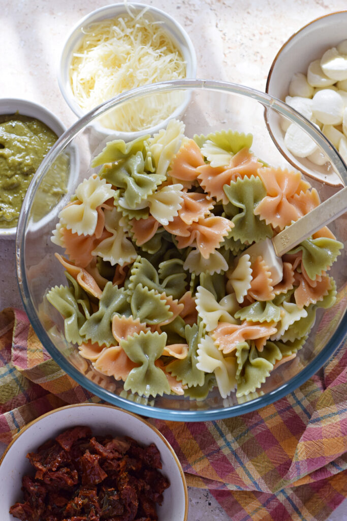 Bowtie pasta in a large glass bowl.