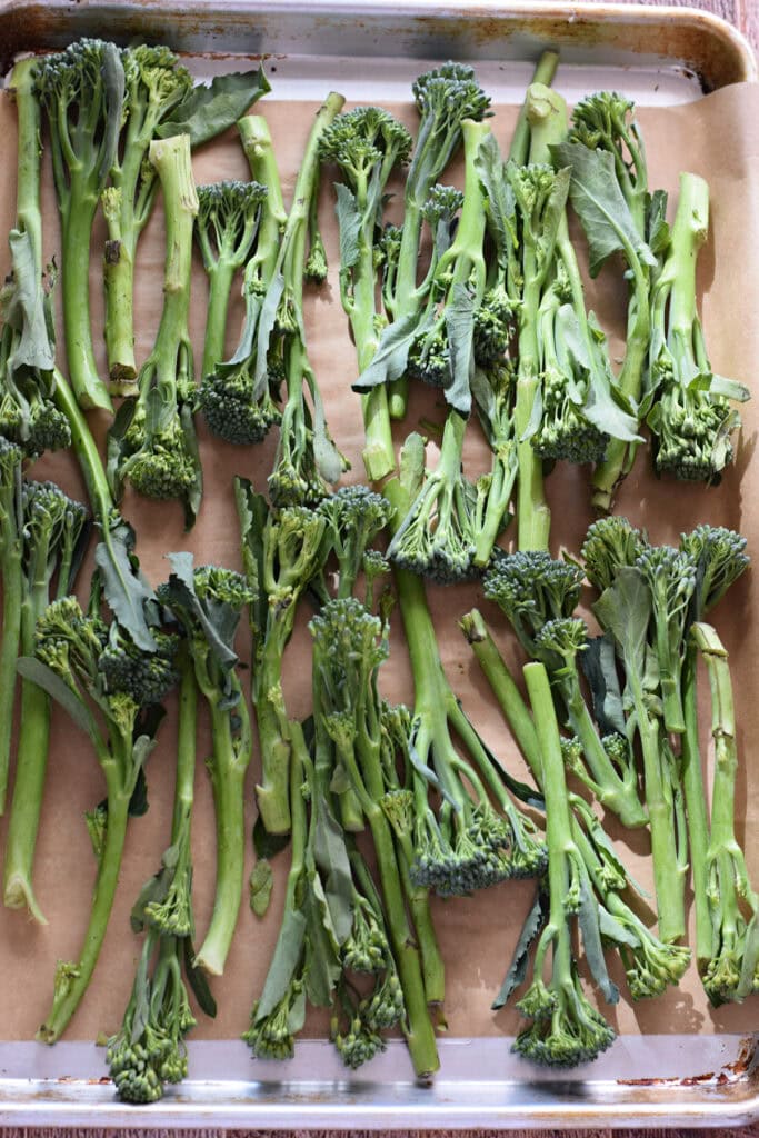 Broccolini on a baking tray.