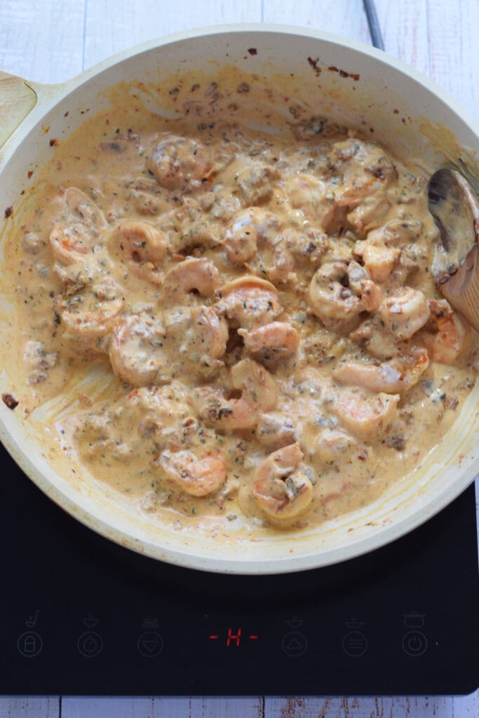 Making a creamy sauce with shrimp.