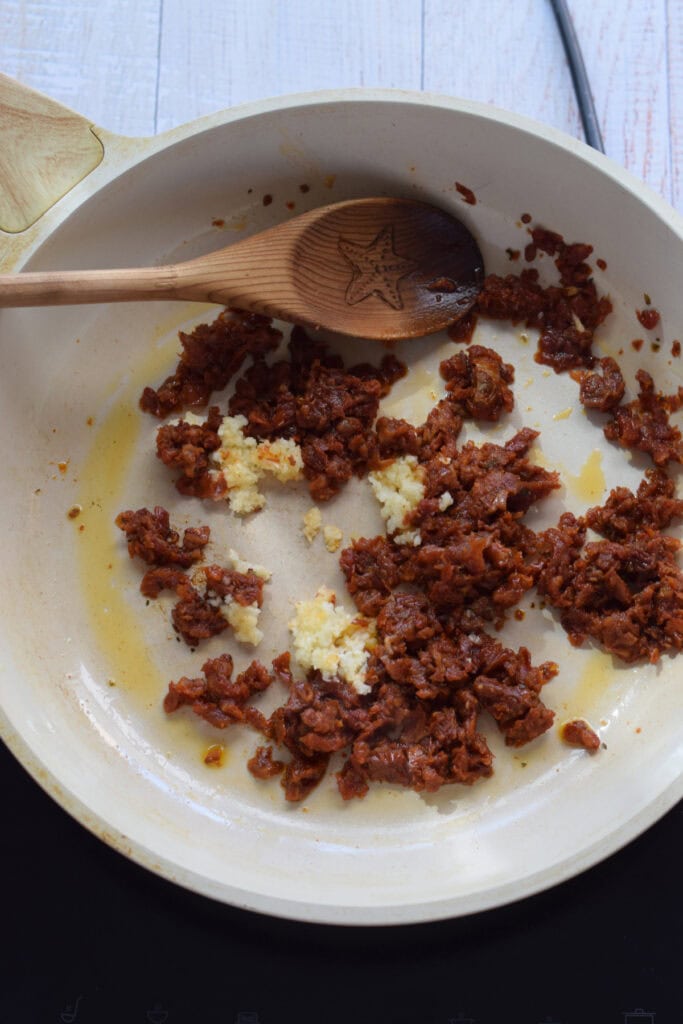 Add garlic to a skillet.