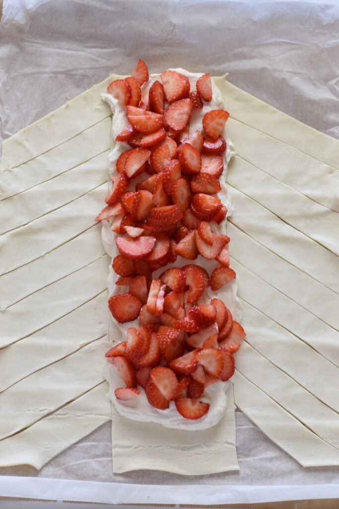 Pastry filled with cream cheese and strawberries.