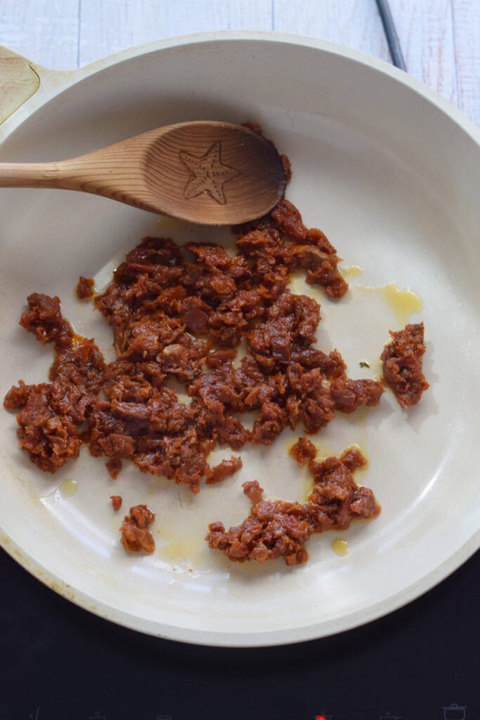 Sun dried tomatoes in a skillet.
