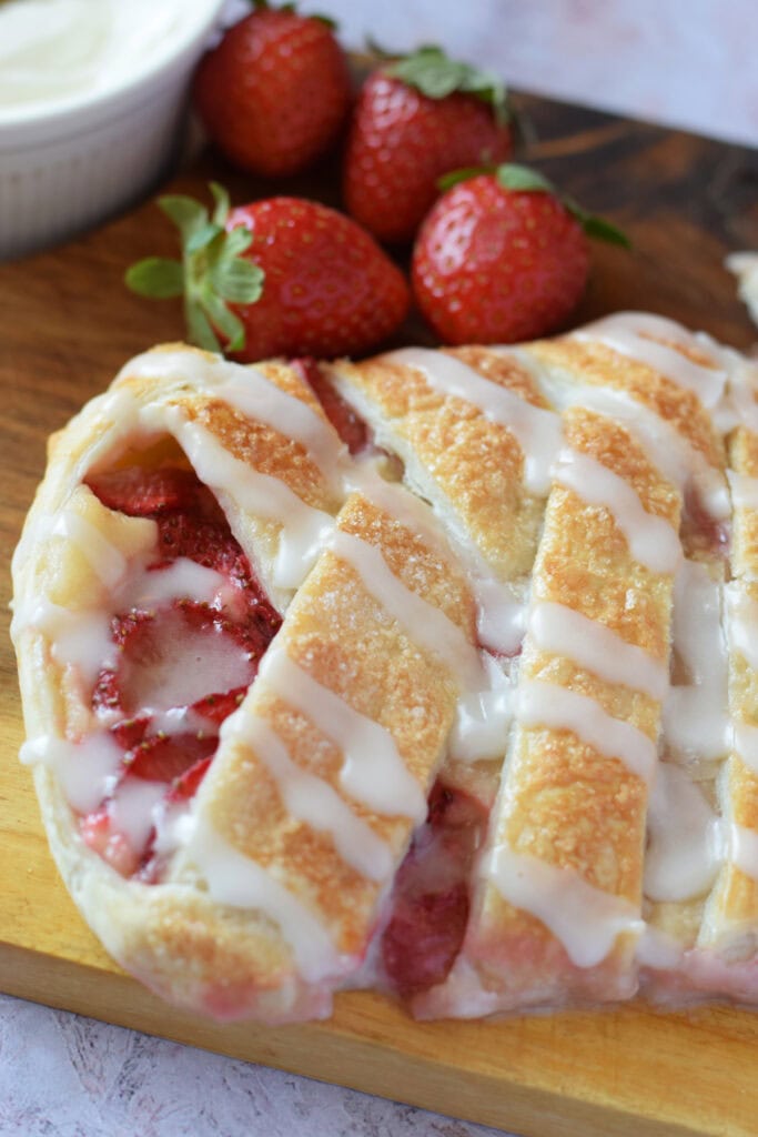 Close up of a strawberry cream cheese danish.