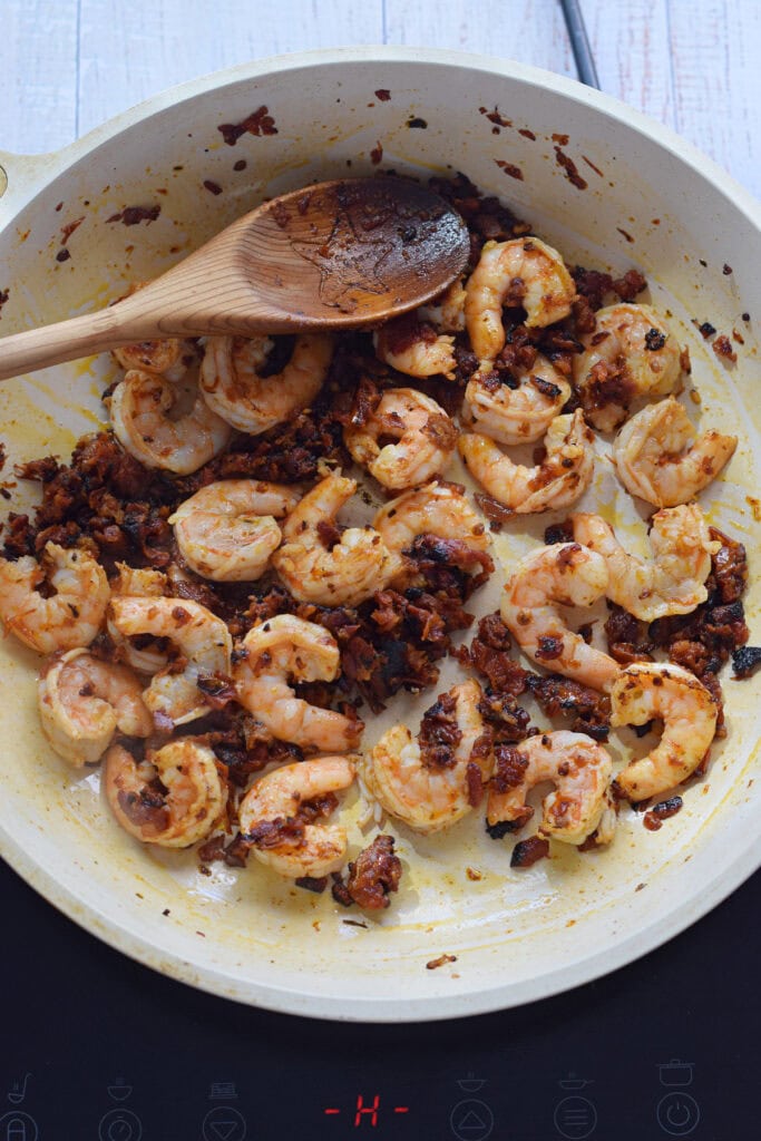 Cooking shrimp in a skillet.