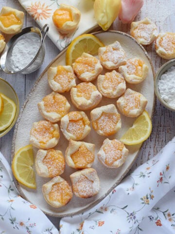 Lemon puff pastry on a whtie plate.