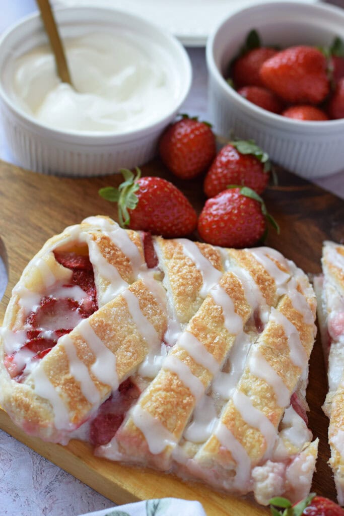 Close up of a strawberry puff pastry braid.
