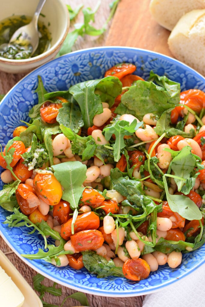 White bean and cherry tomato salad in a bowl.