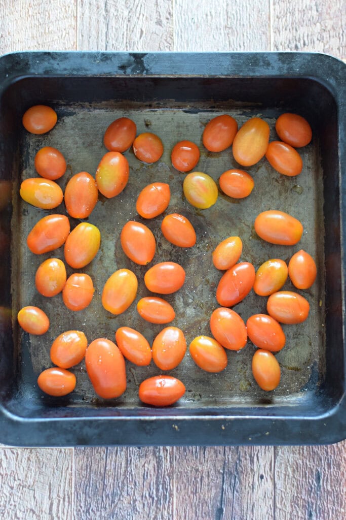 Cherry tomatoes in a roasting dish.