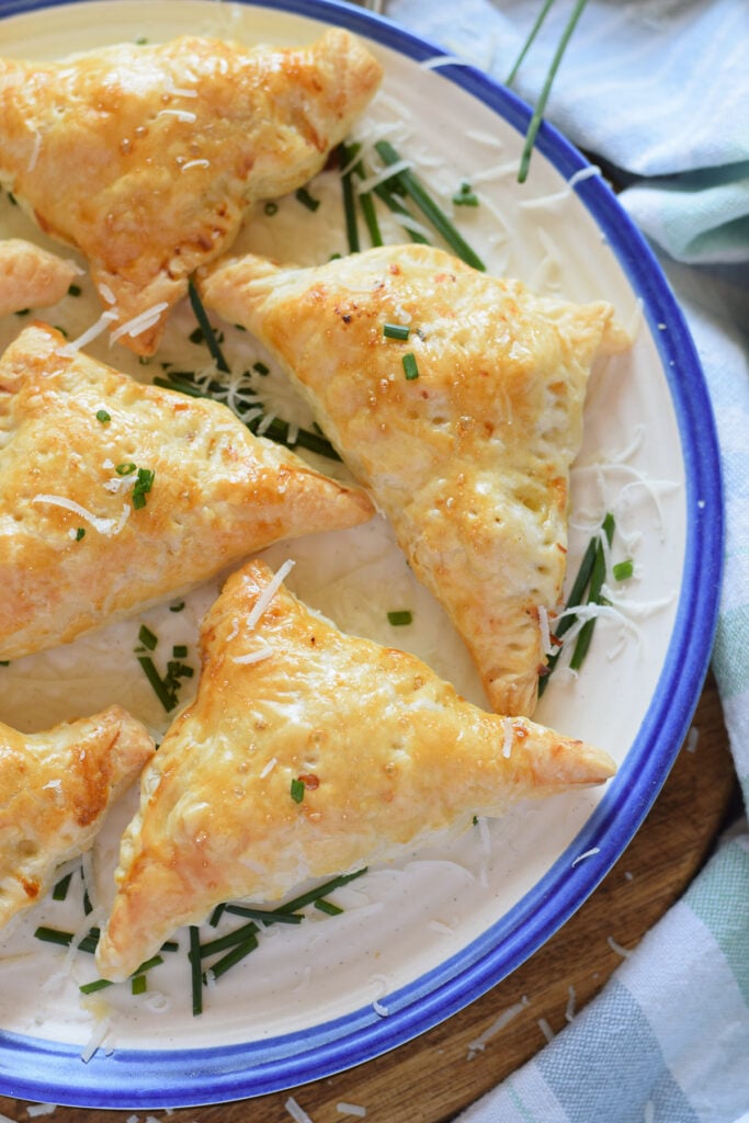 Chicken pastries on a plate.
