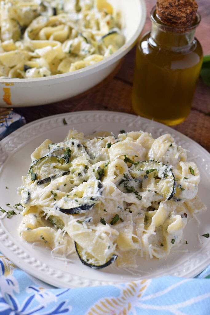 Close up of zucchini ricotta pasta on a plate.