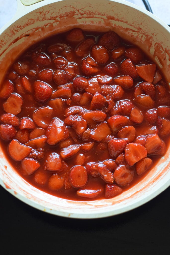 Cooked strawberries in a skillet.