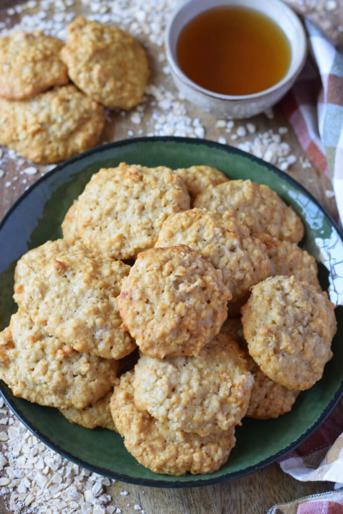 Oatmeal cookies on a green plate.