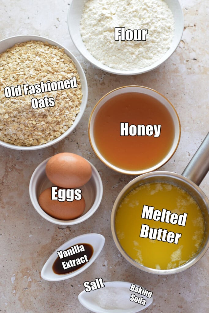 Ingredients to make honey oatmeal cookies.