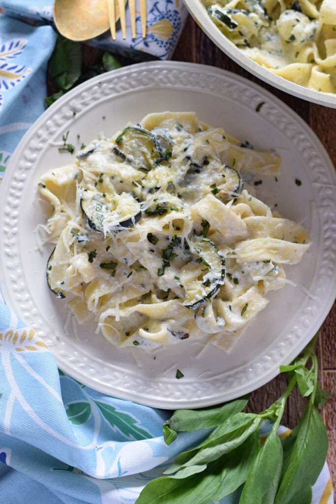 Zucchini pasta on a white plate.