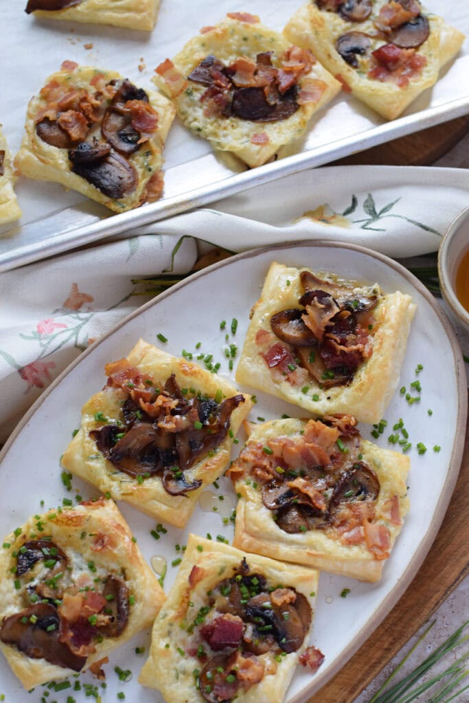 Mushroom puff pastries on a white plate.