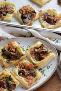 Mushroom puff pastry tarts on a plate.