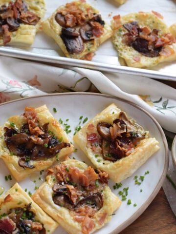 Mushroom puff pastry tarts on a plate.