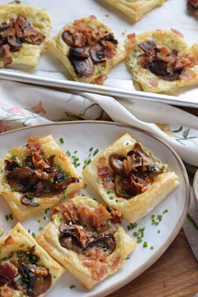 Mushroom puff pastry tarts on a plate.