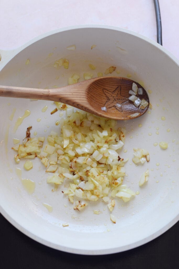 Sautee onions in a skillet.