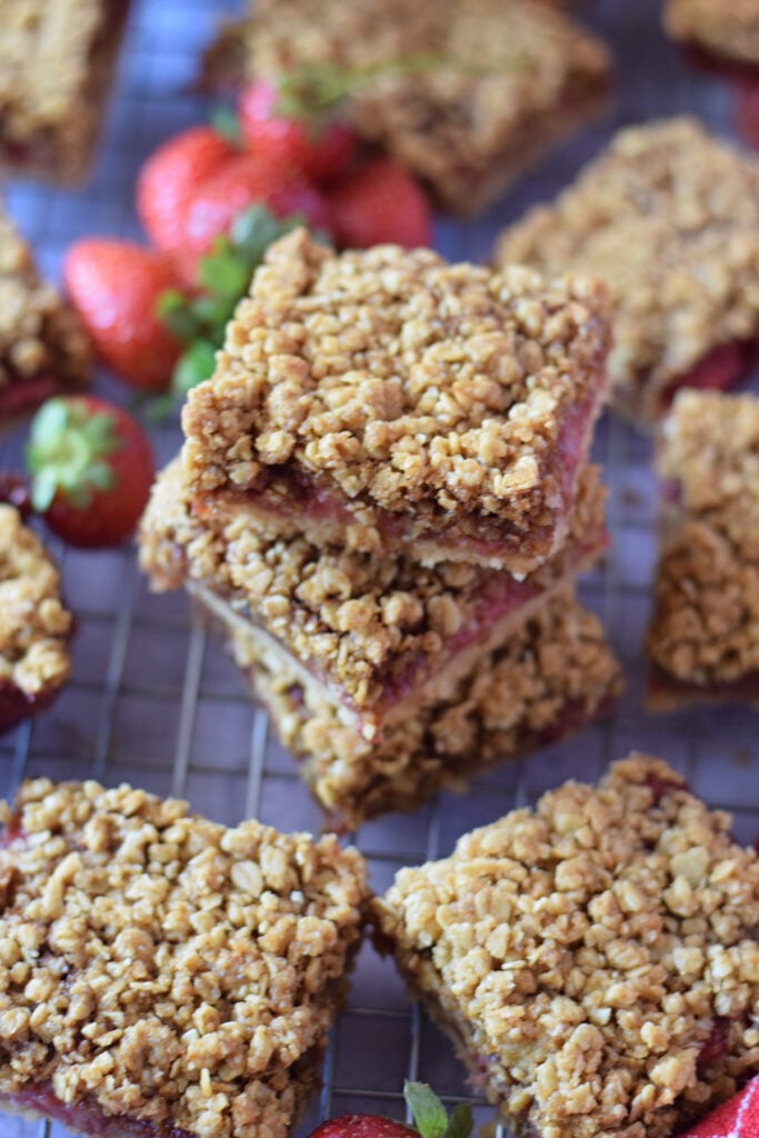 A stack of strawberry crumble bars.