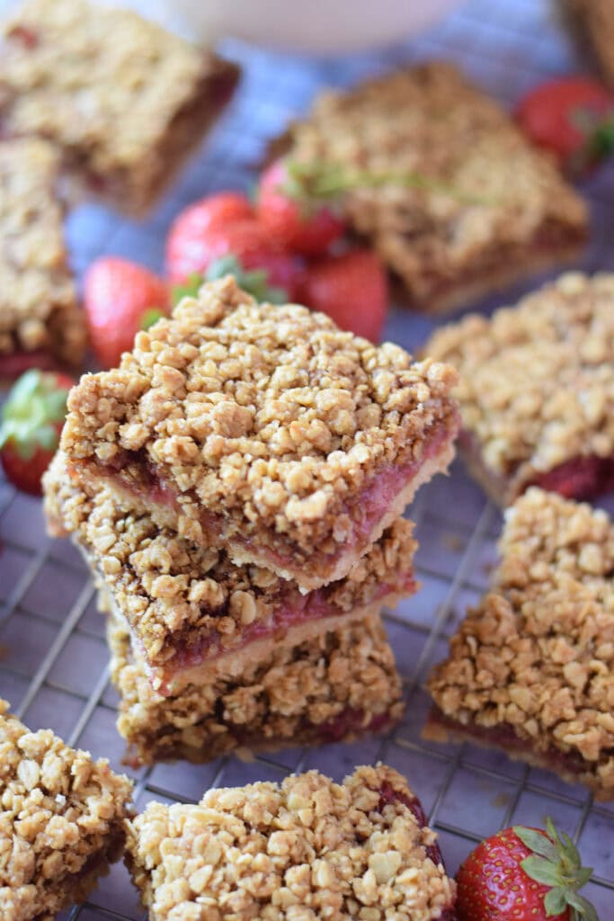 A stack of strawberry crumble bars.