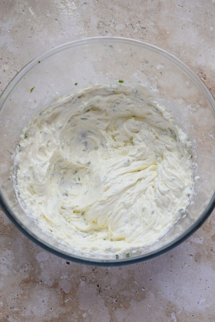 Whipped mascarpone topping in a glass bowl.