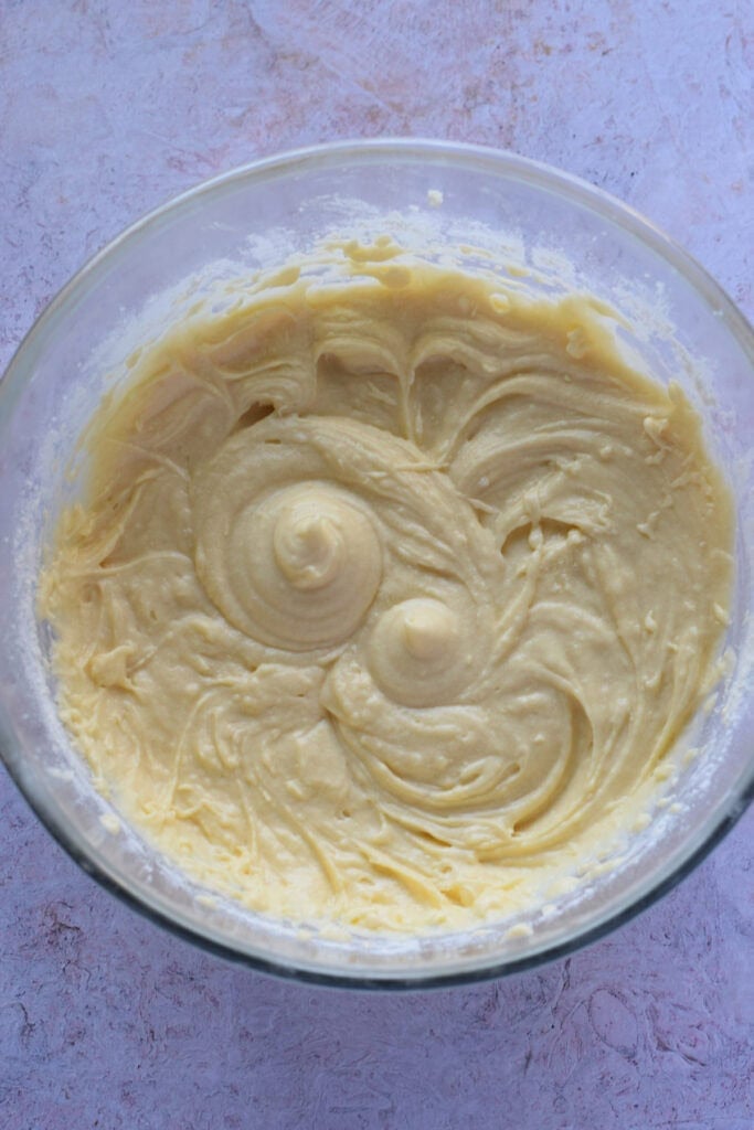 Cake batter in a glass bowl.