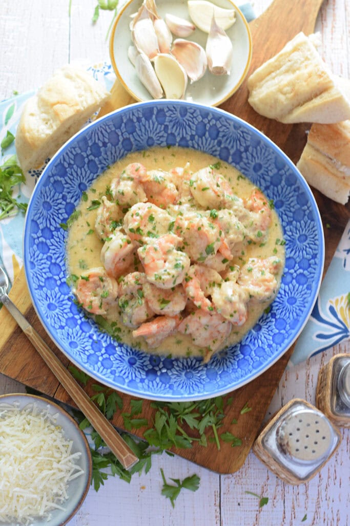 Garlic shrimp in a blue bowl.