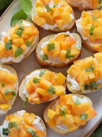 Close up of peach crostini.